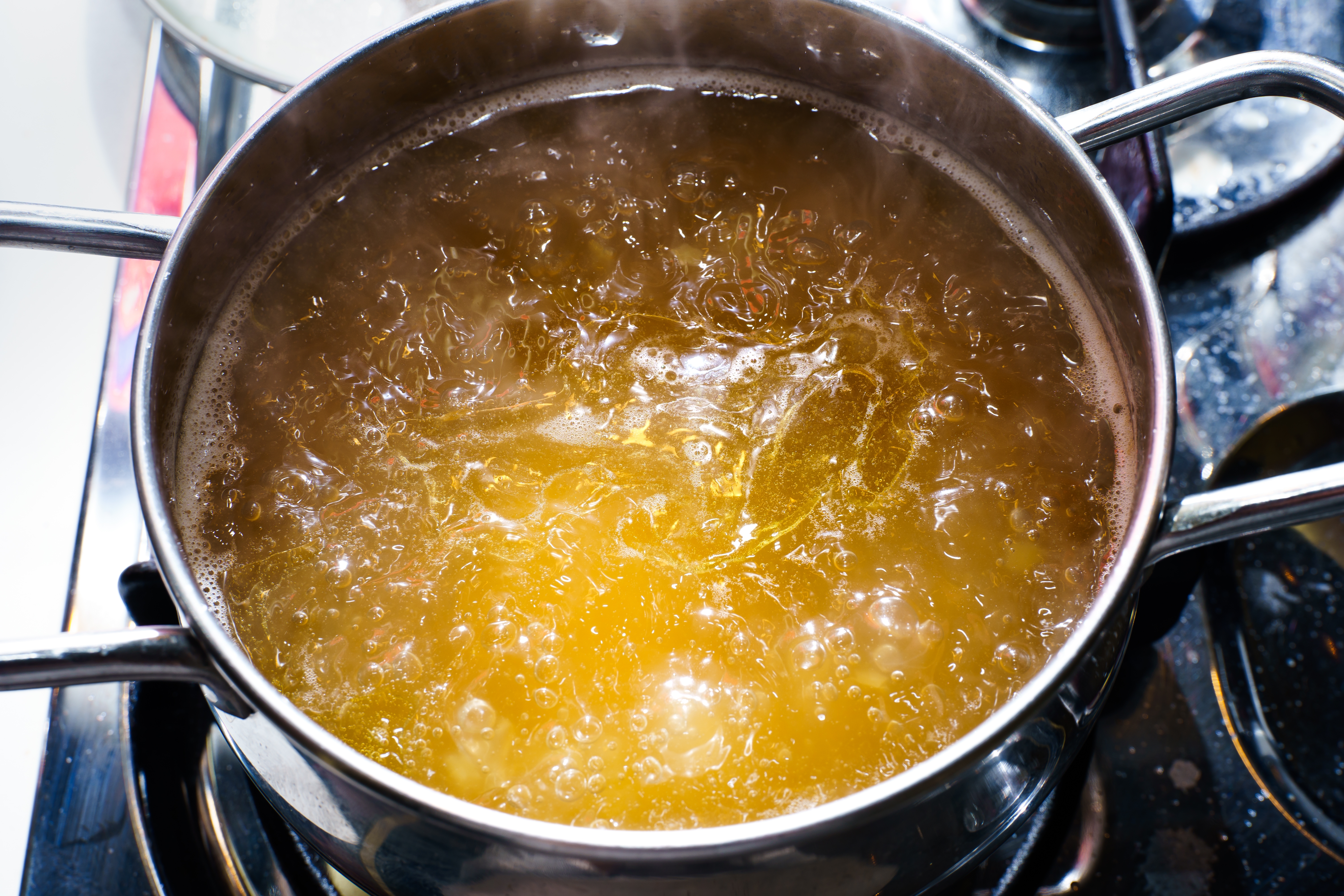 Beef broth boiling in a pan | Source: Shutterstock